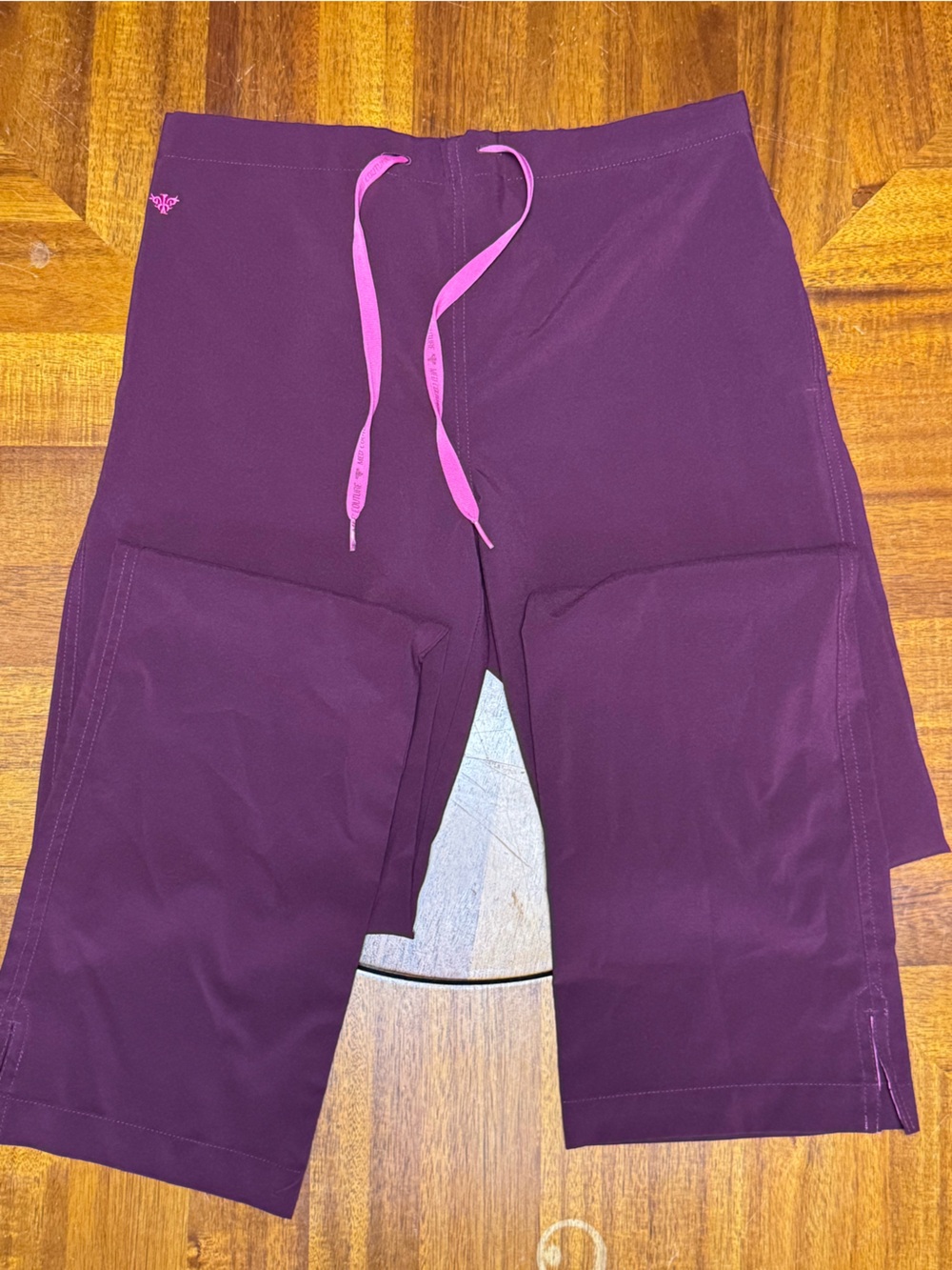 Med Couture women’s scrub Pants in wine  with Pink Drawstring. Size medium tall